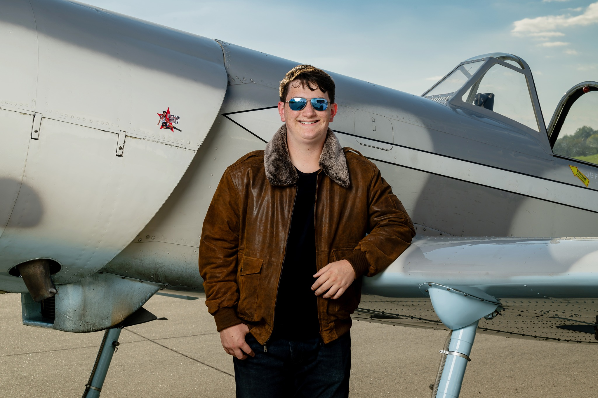Senior portrait by airplane